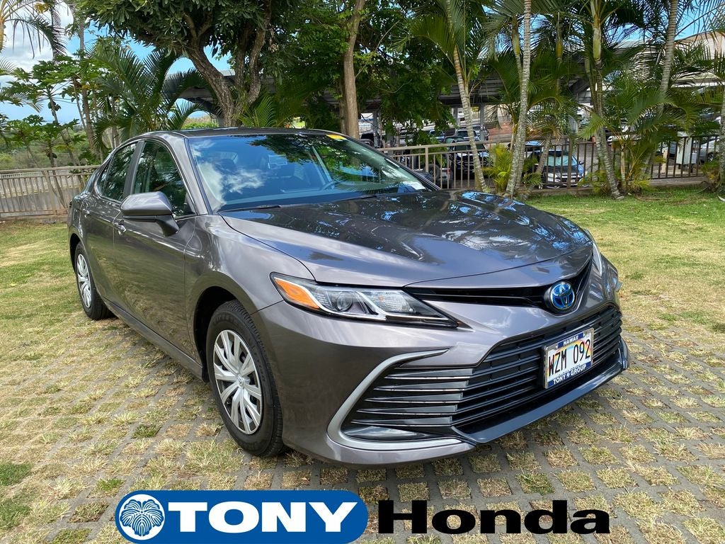 2024 Toyota Camry Hybrid LE in Predawn Gray Mica — front three-quarter view